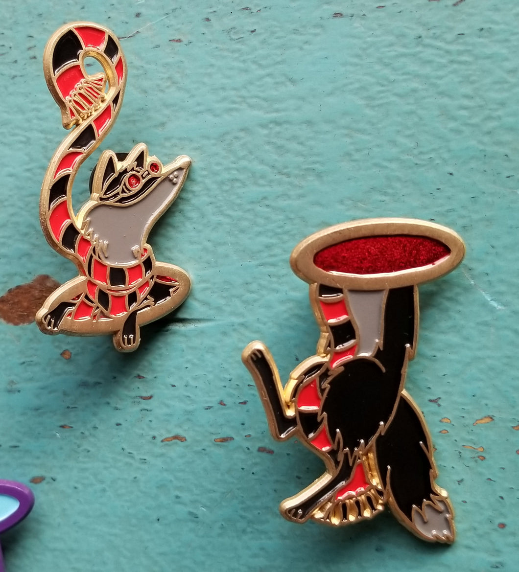 Black and red fox pin pair