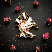 Load image into Gallery viewer, Mari Lwyd magnet with black and white sheet and orange eye
